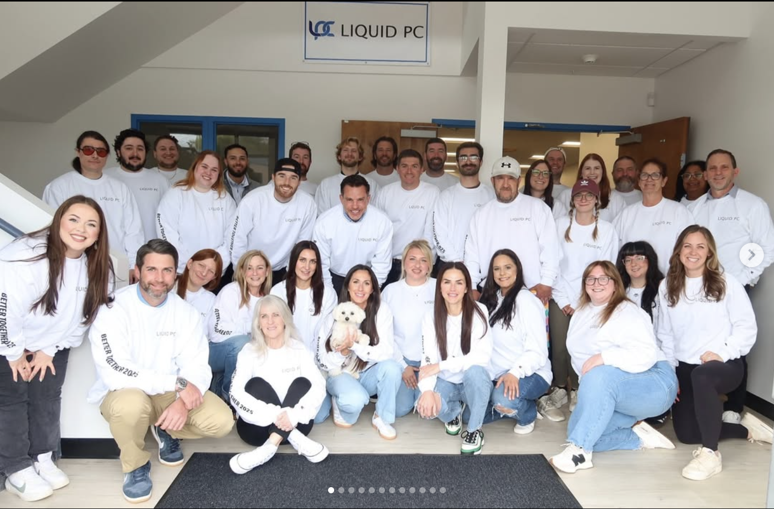 Diverse Liquid PC team collaborating in office
